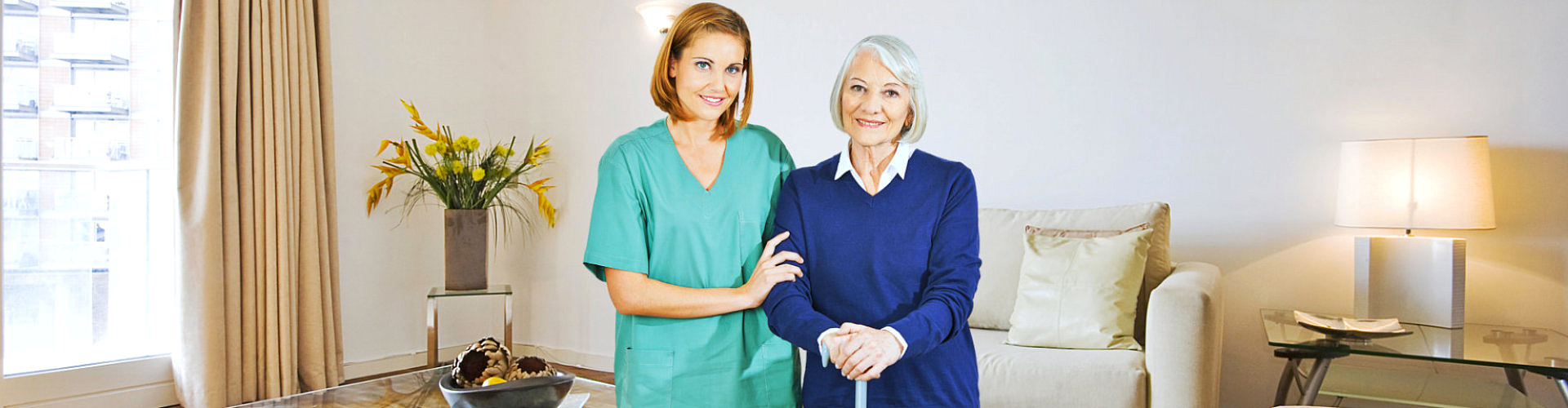 elderly woman with her caregiver at home