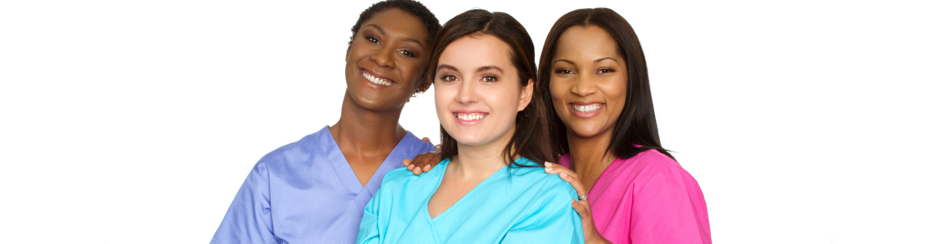 three nurses smiling and looking at the camera