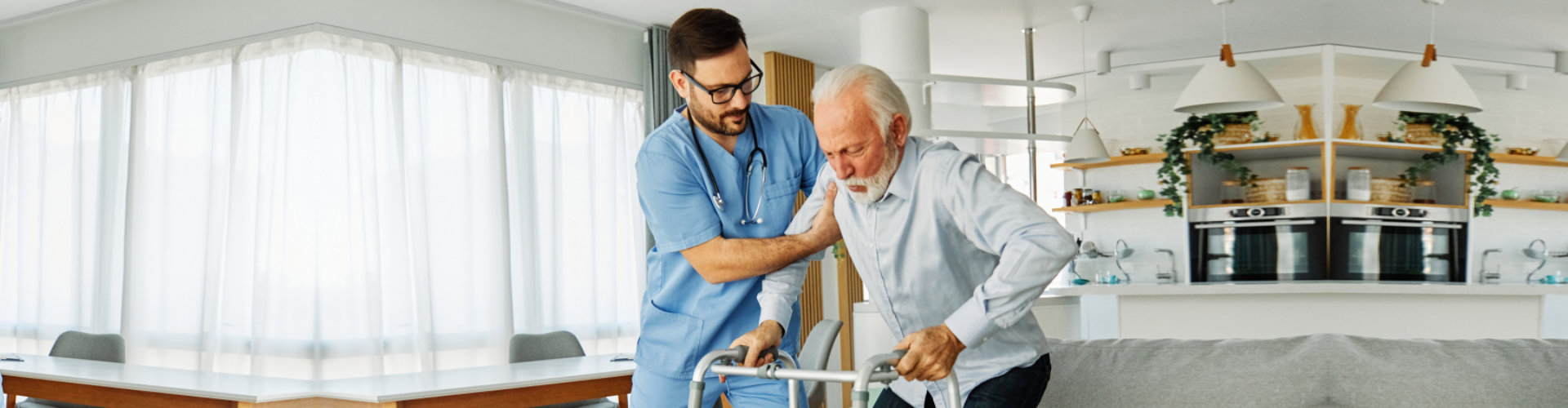 caregiver assisting senior man on his walker